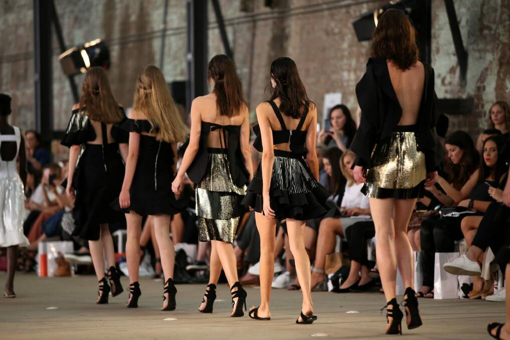 The models at By Johnny's show at Mercedes-Benz Fashion Week put their backs into it. Photo: Caroline McCredie
