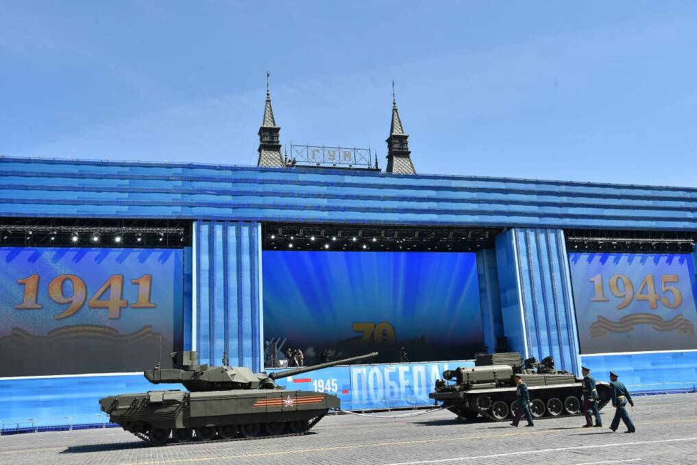 A T-14 tank (left) is ready to be towed for the Victory Day parade through Moscow's Red Square. Photo: Kirill Kudryavtsev