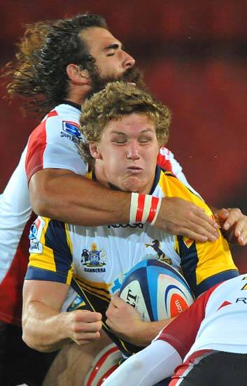 Big hit &#8230; Michael Hooper is tackled by Josh Strauss. Photo:  Getty Images