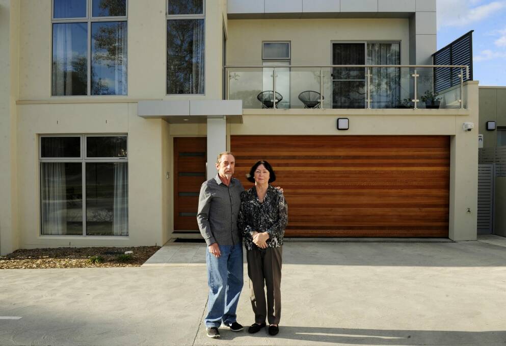 Brian and Lyn Wenn, unhappy at delays getting into their new government-developed townhouse at Garran. Photo: Melissa Adams