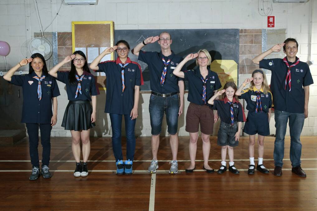 ACT Scouts from different language groups, from left, Chinese Phoenix Scout Group leader Joanne Guth, venturer Sunny Xu, rover Jessica Ying with Les Explorateurs cub scout leader Philippe Moncuquet, assistant cub scout leader Sarah Moncuquet, joey Marion Moncuquet, cub Coline Moncuquet and Pioneros Scout Group cub scout leader Carlos Torres.  Photo: Jeffrey Chan.
