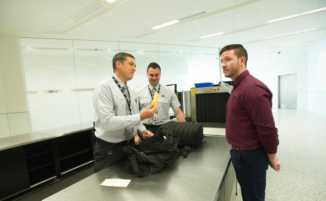Biosecurity officers monitoring bags at the luggage check point.  Photo: Karleen Minney