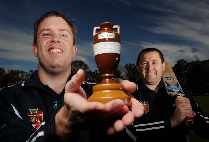 Canberra blind cricketers Cameron Roles, left, and Nick Haydar show off the Ashes urn, which they were allowed to bring back to Australia. Photo: Colleen Petch