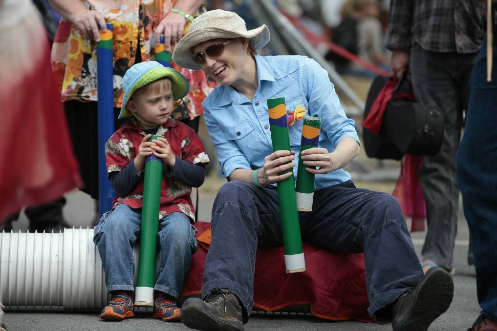 Rio Wolfe, 4, and Naomi Wolfe of Cook join in on the music. Photo: Jeffrey Chan