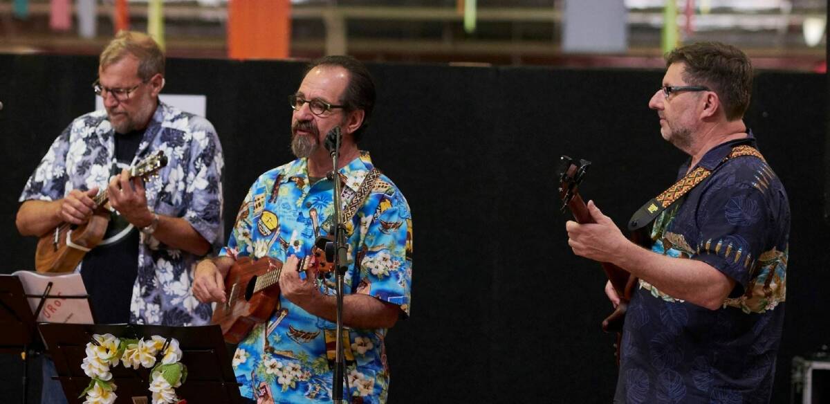 The Ukulele Republic of Canberra celebrates 10 years of happy strumming in May. Photo: Supplied