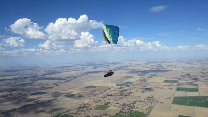 Record-breaking paraglider Kari Roberson over farmland in Hay, NSW. Photo: Supplied