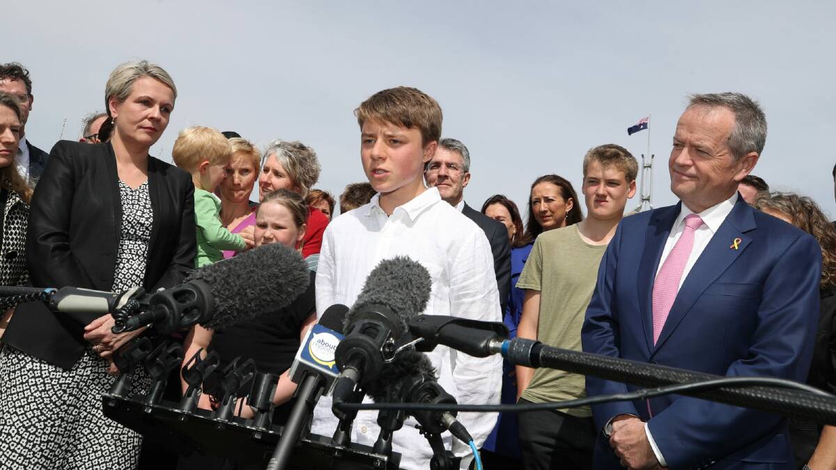 Eddie Blewett with Opposition Leader Bill Shorten after he addressed the media in support of same-sex marriage outside Parliament House. Photo: Andrew Meares