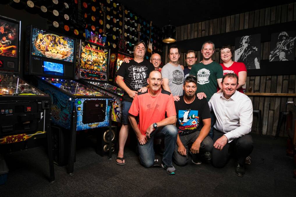 Canberra's Retro Gaming group Vice City Players. Members (Back Row) Steve Hyde, Andrew Zeylemaker, Sam McKeon, James Todd, Andrew Wellington, Natalie Holt, (Front Row) Andy Craig, Michael Jukic, and Paul Higginbotham.  Photo: Dion Georgopoulos