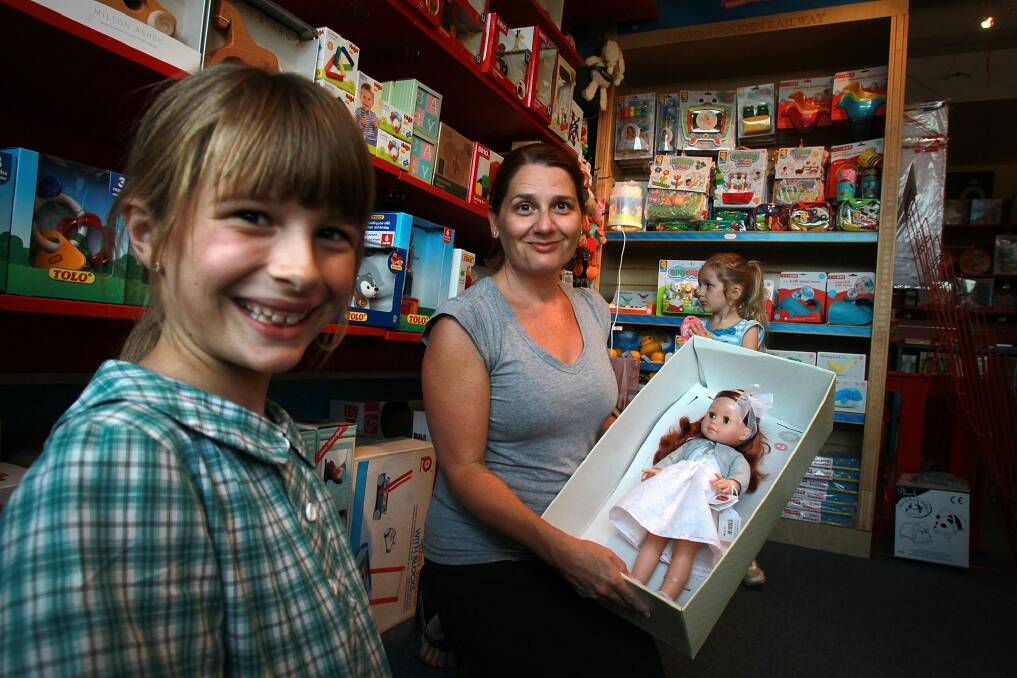 Taitum Watts, 9, of Dulwich Hill, with her mother Shannon and sister Faryn at Monkey Puzzle in Summer Hill. Photo: Ben Rushton