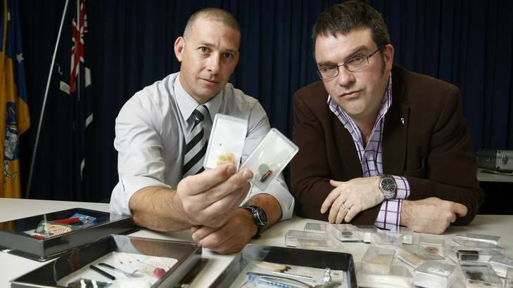 WRONG STUFF: Detective Sergeant Shane Scott and emergency medicine consultant Dr David Caldicott with some drug examples. Photo: Jeffrey Chan