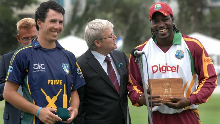 Joint Man of the Match award winners, Tom Cooper, left and Chris Gayle with PM Kevin Rudd in 2010. Photo: Graham Tidy