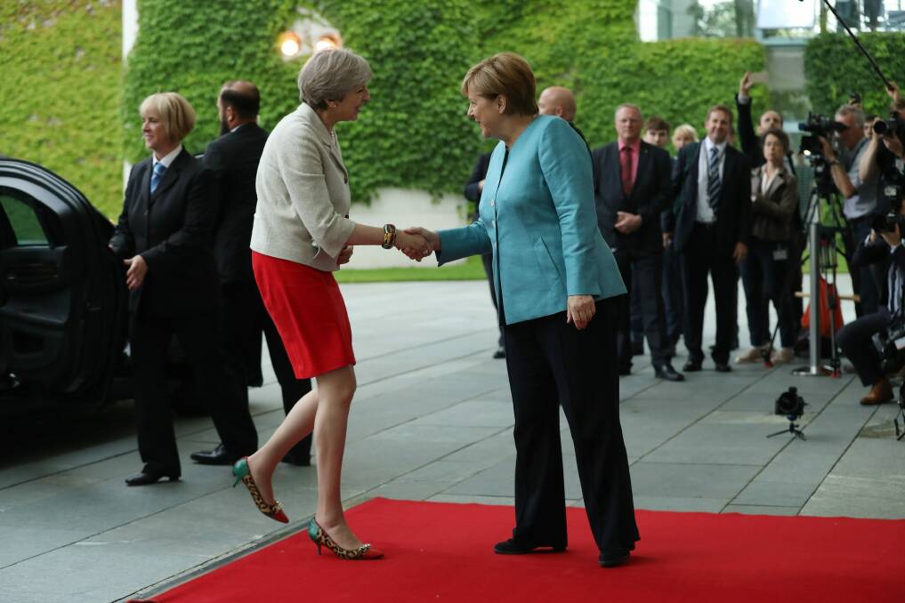 German Chancellor Angela Merkel greets British Prime Minister Theresa May before a meeting of European Union leaders at the Chancellery in Berlin. Photo: Getty Images