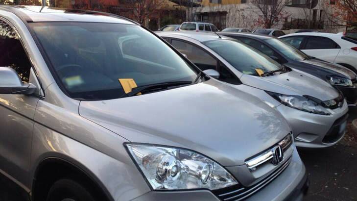 BOOKED: Some of the cars with infringement notices at Woden on Tuesday. Photo: Tom McIlroy