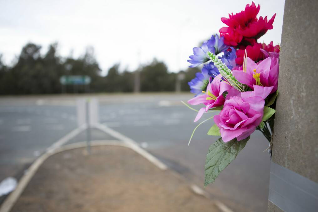 Flowers left on a pole as a memorial for the fatality that happened on Wednesday night. Photo: Jamila Toderas