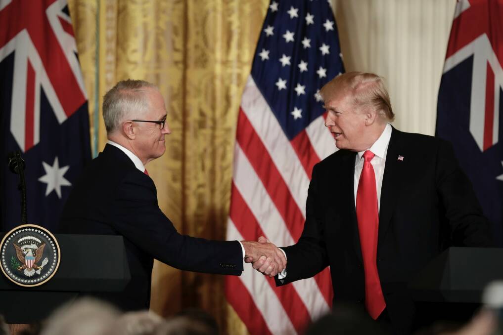 Prime Minister Malcolm Turnbull and United States of America President Donald Trump shake hands as they address the media during a joint press conference in the East Room at the White House during the Prime Minister's official visit to Washington DC. Photo: Alex Ellinghausen