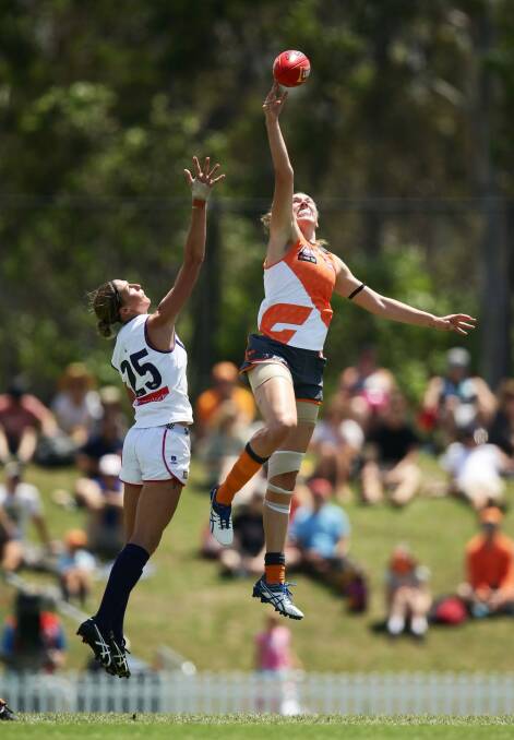 Rising Star: Erin McKinnon rises high in the ruck against Fremantle. Photo: Getty
