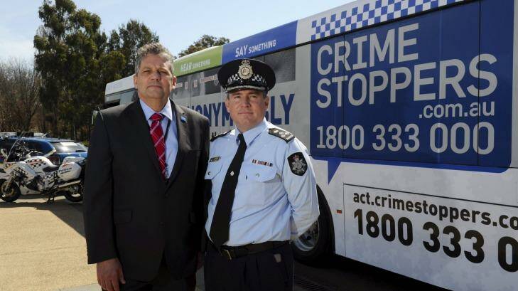 Team work: Crime Stoppers head Bryan Roach with ACT Policing’s David Pryce. Photo: Graham Tidy