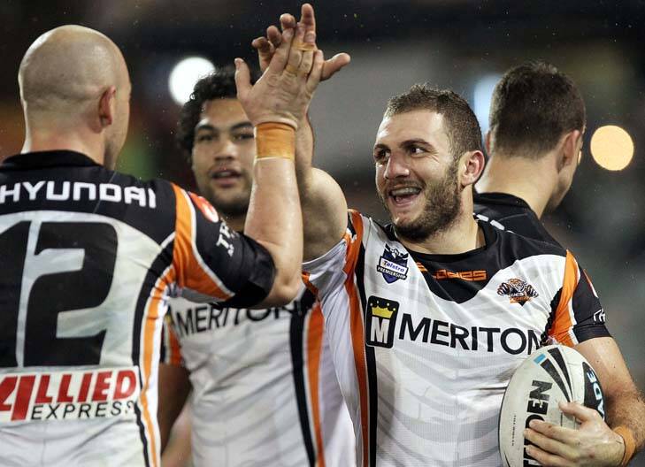 All smiles ... Robbie Farah high-fives Liam Fulton after his pass helped him cross the line for a first-half try. Photo: Images