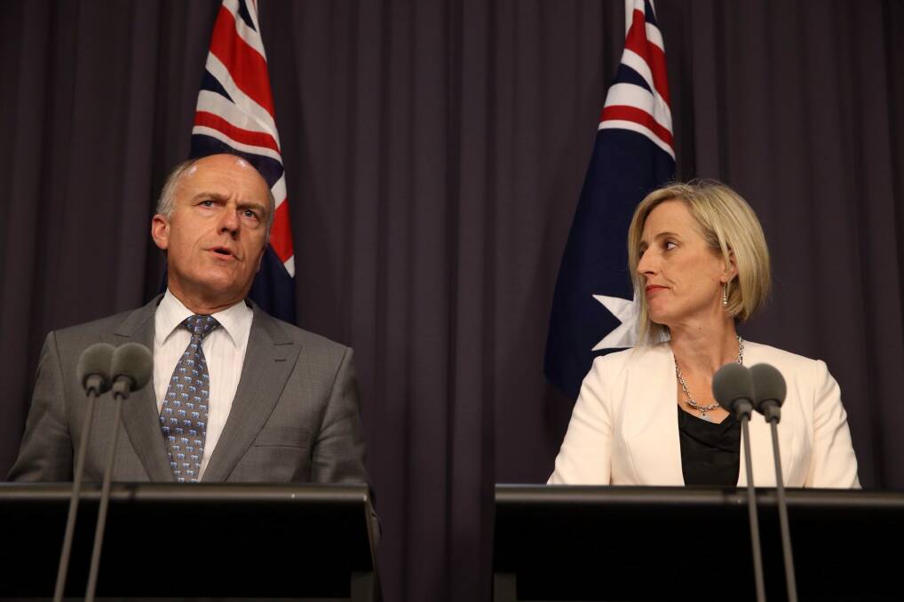 ACT Chief Minister Katy Gallagher and Federal Employment Minister Senator Eric Abetz announce a $1 billion federal loan to resolve the Mr Fluffy asbestos crisis in the ACT. Photo: Andrew Meares