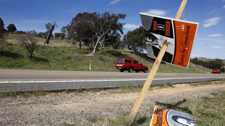 Damaged Labor campaign signs along William Hovell Drive in Belconnen. Photo: Jeffrey Chan
