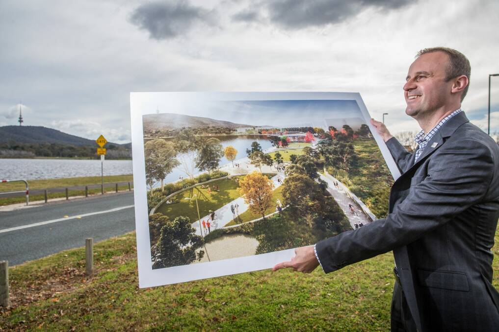 Chief Minister Andrew Barr with plans for the new lakeside park. Photo: Matt Bedford