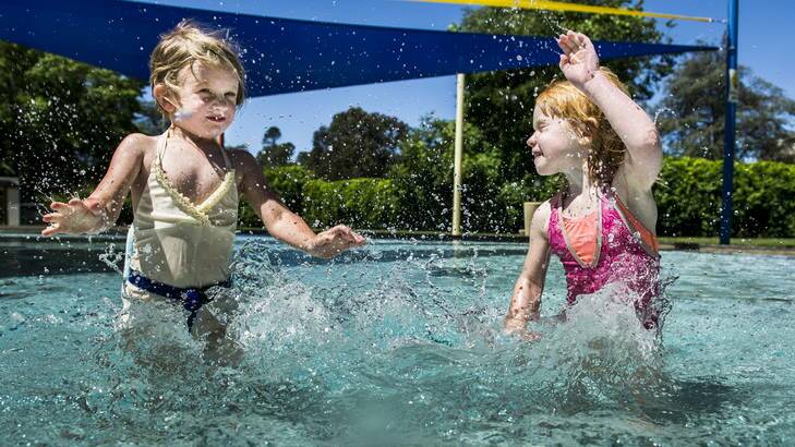 Penelope, 4, and Sage Haling, 3, playing at Manuka Pool earlier this month. Photo: Rohan Thomson