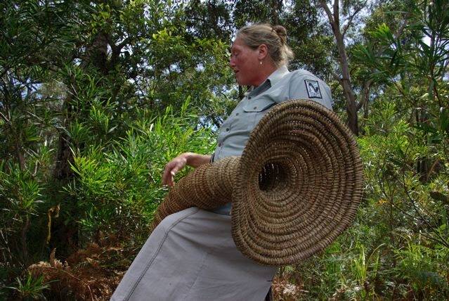 Indigenous educator 'Aunt Julie' with a traditional eel trap. Photo: Dahlia Abdel-Aziz