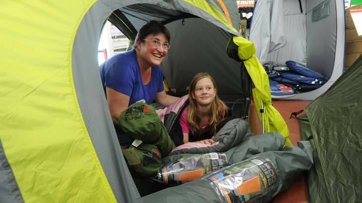 Preparing for a camping trip to Tasmania early in January at Anaconda in Fyshwick are Melissa Leggett of Duffy with daughter, Sophie, 10. Photo: Graham Tidy