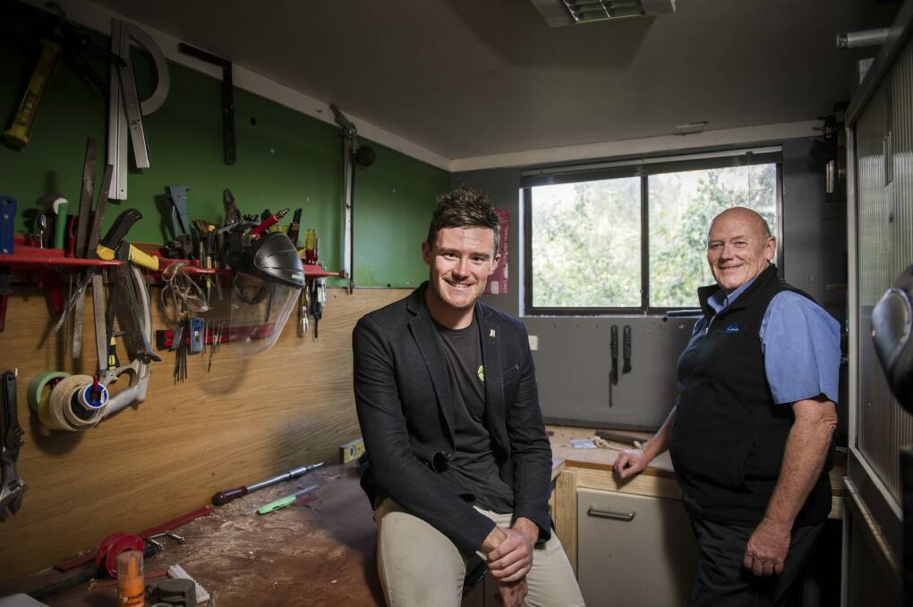 Rising businessman Mick Spencer with his father Greg, in the small shed where Mick, at 19, started his sports gear company. Photo: Rohan Thomson
