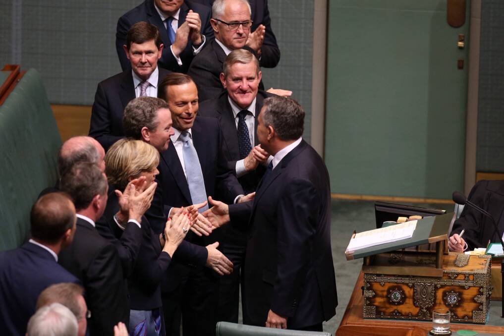 Premature congratulation? Then prime minister Tony Abbott and the front bench congratulate treasurer Joe Hockey after his budget speech last year. Photo: Andrew Meares