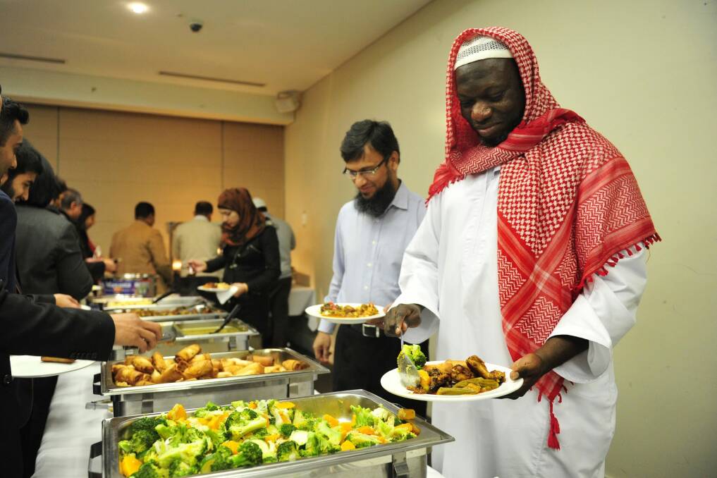  NEWS: Osman Adam of Harrison at the Ramadan Iftar dinner at the Theo Notaras Multicultural Centre. . 3rd July 2014.  Photo: Meiissa Adams