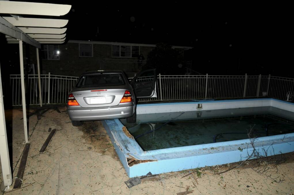 Stolen Mercedes almost drives into pool. Photo: ACT Police Media