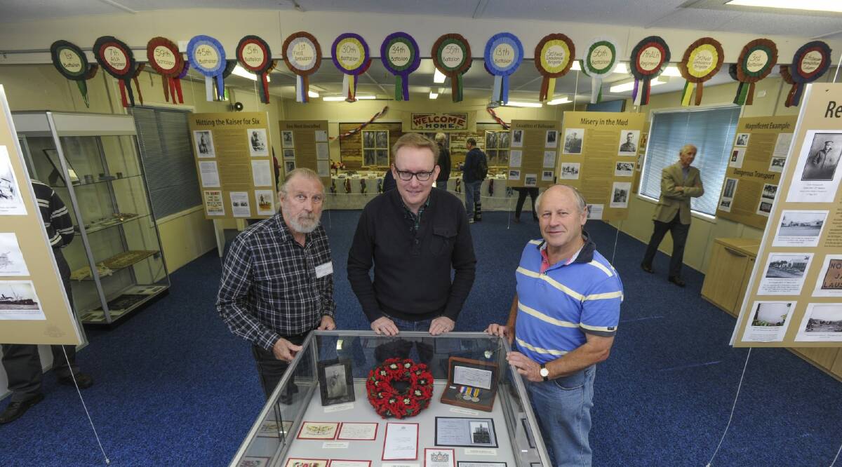 At the Hall School Museum, community members are concerned that the ACT Government will start charging rent for the buildings they occupy. From left, museum curator, Phil Robson, David Hazlehurst from the Village of Hall and district progress association and John Kenworthy from Rotary. Photo: Graham Tidy