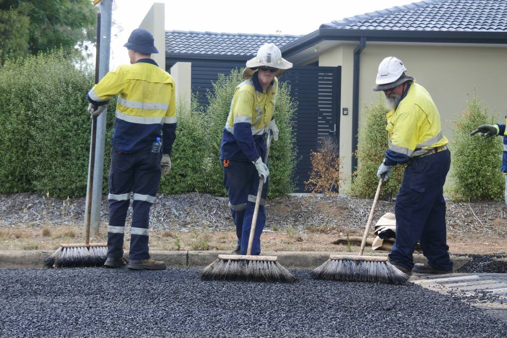 First batch of Tonerseal is laid on Onkaparinga Crescent in Kaleen. Photo: Claudia Long