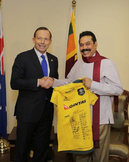 Tony Abbott with then president Mahinda Rajapaksa during a 2013 visit to Sri Lanka. Photo: Getty Images