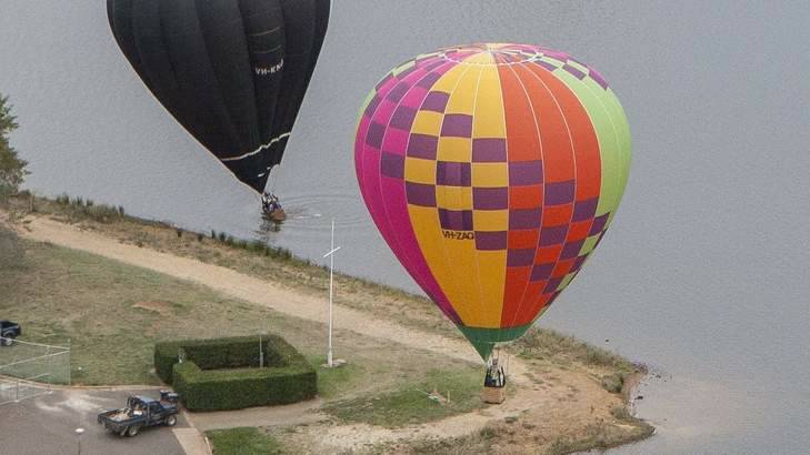 A balloon lands in Lake Burley Griffin this morning. Photo: Daniel Keeffe