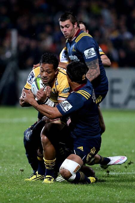 Christian Lealiifano tries to break through the Highlanders' defence. Photo: Getty Images