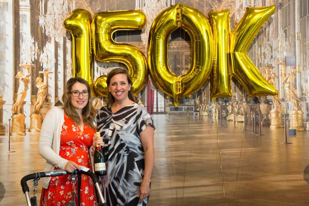 The 150,000th visitor to the Versailles: Treasures from the Palace exhibition, Amelia Dimitrovski, 32, from Gungahlin celebrating the milestone with National Gallery of Australia assistant director Alison Wright. Photo: Supplied