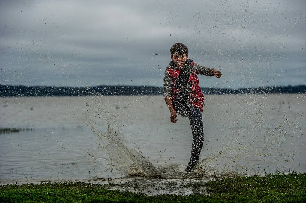 Tom Osborne, 11, splashes around in Lake George.  Photo: Karleen Minney