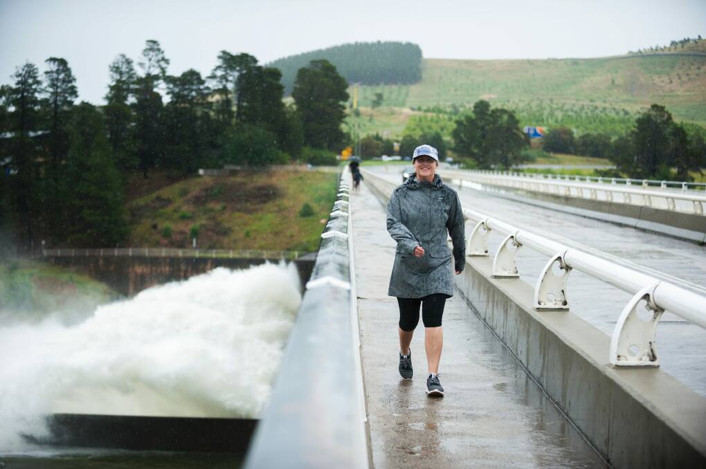 Deb Renkin walking across the Scrivener Dam. Photo: Dion Georgopoulos