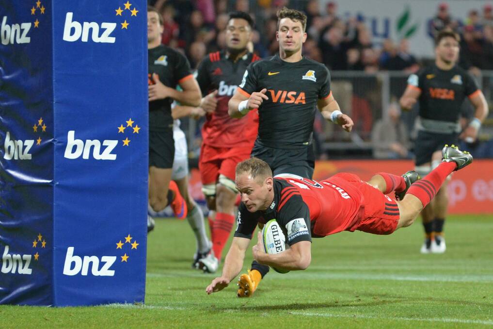 Andy Ellis of the Crusaders dives over to score a try against the Jaguares at AMI Stadium on April 15. Photo: Getty Images