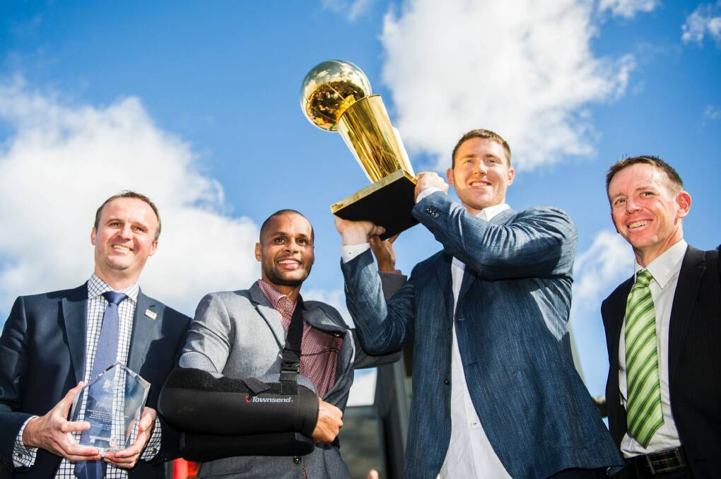 Andrew Barr, Patrick Mills, Aron Baynes and Shane Rattenbury with the Keys to the City and NBA Trophy. Photo: Rohan Thomson