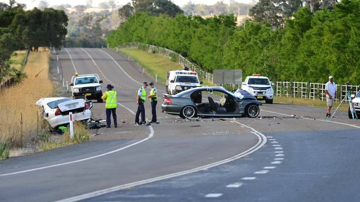 Police document the scene of a head on collision on the Barton highway between Hall and Murrumbateman on Friday. Photo: Katherine Griffiths