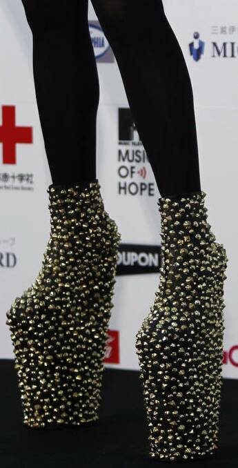 Lady Gaga's shoes are seen as she poses after performing at the MTV Video Music Aid Japan in Chiba. Photo: Reuters