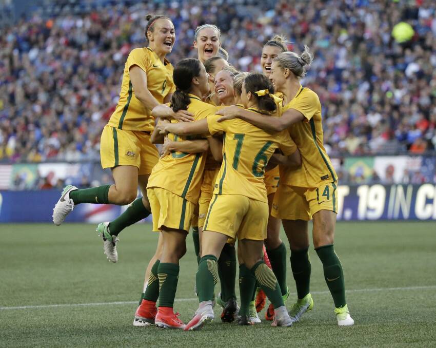Australian players celebrate scoring a goal against the United States during the second half of a Tournament of Nations in 2017.