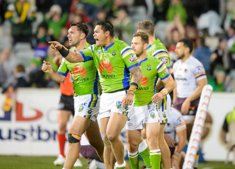 Canberra Raiders centre Joey Leilua roars after scoring a try against the Broncos.  Photo: Sitthixay Ditthavong