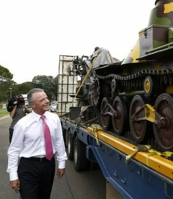 Director of the Australian War Memorial Dr Brendan Nelson checks out a British 9.2 inch Howitzer and a Japanese Type 95 Ha-Go tank that have arrived in preparation for the Australian War Memorial Open Day. Photo: Jeffrey Chan