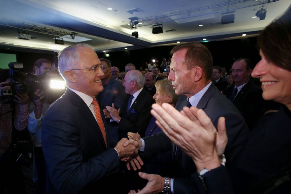 Mr Turnbull greets Mr Abbott before the launch. Photo: Andrew Meares