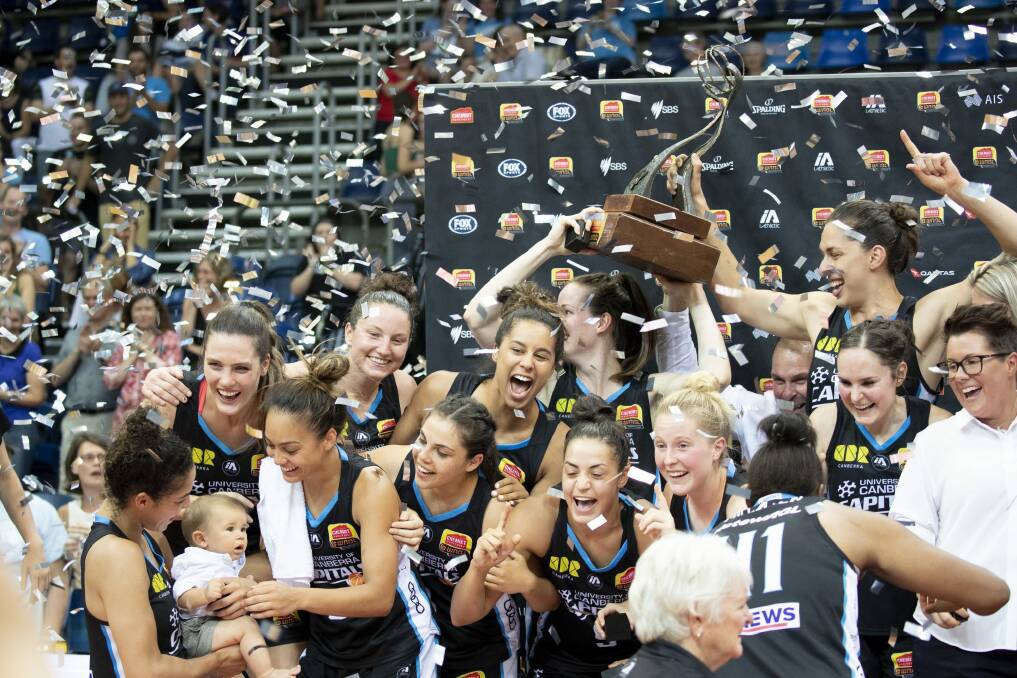 The Canberra Capitals celebrate their grand final win last month in the WNBL. Photo: Sitthixay Ditthavong