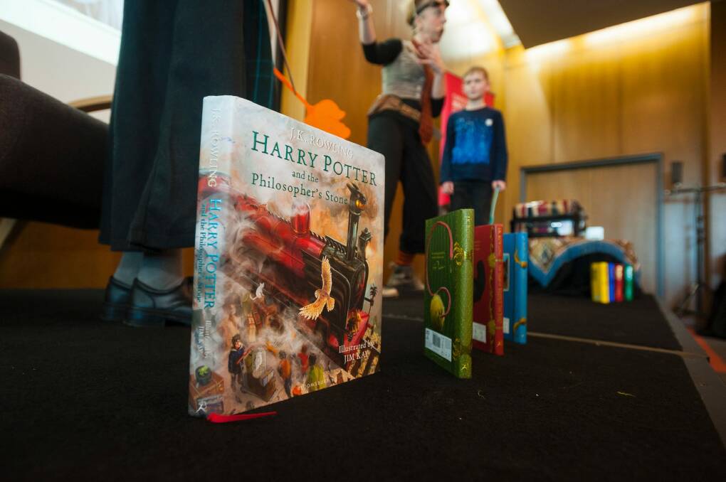 Professor Frankie highlights some of the Harry Potter books.  Photo: Dion Georgopoulos